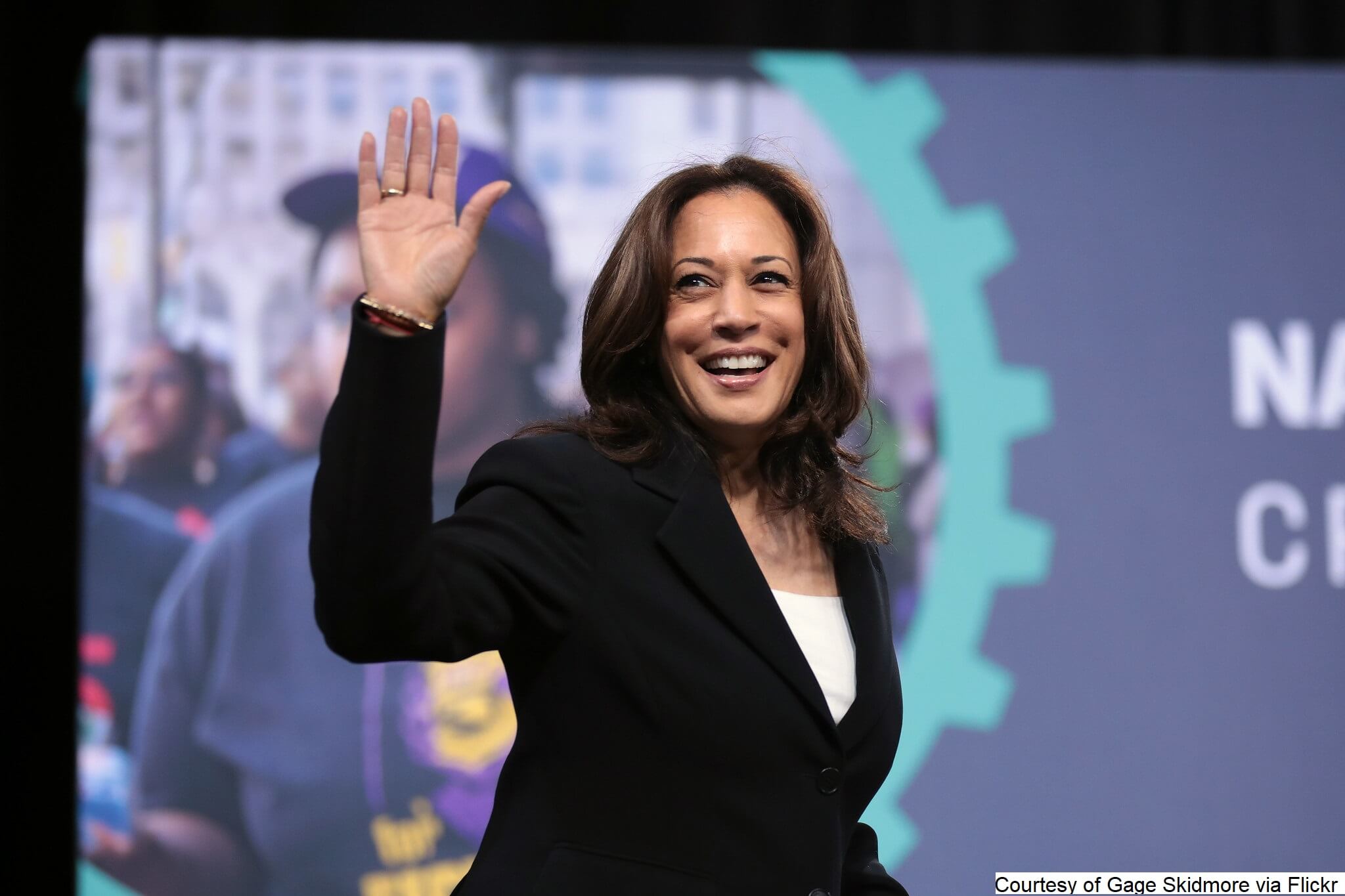 Kamala Harris waving and smiling 2024